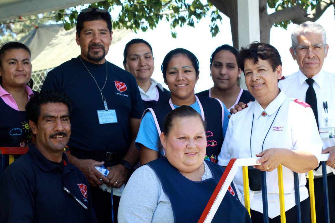 group of people smiling outside