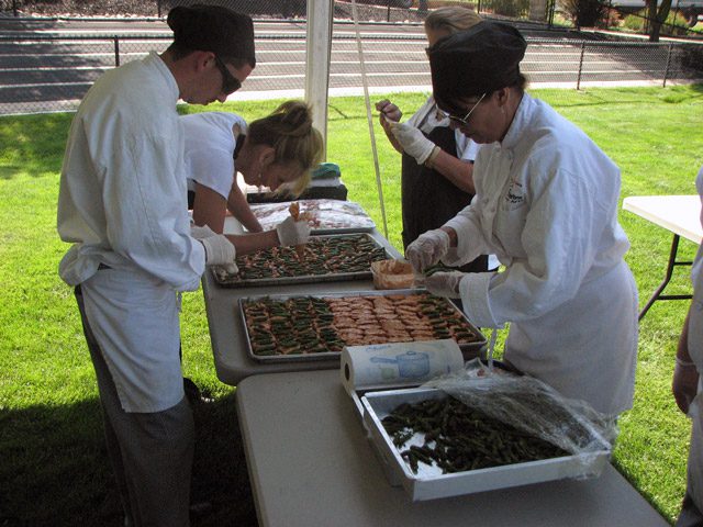 People cooking outside