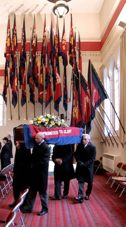 The coffin passes the sessional flags (Photo: Julie D. Tostevin)