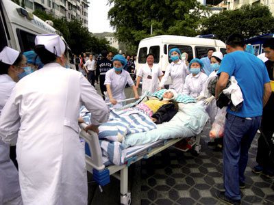 Medical staff treat an earthquake victim