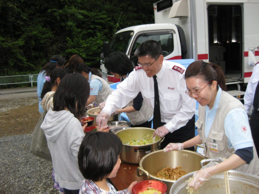 Salvation Army Officers serving food in Japan