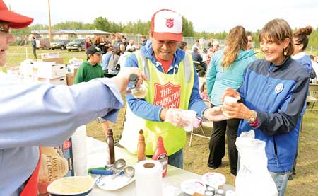 Army volunteers serve refreshments to Galena residents. Photo courtesy of the Alaska Division