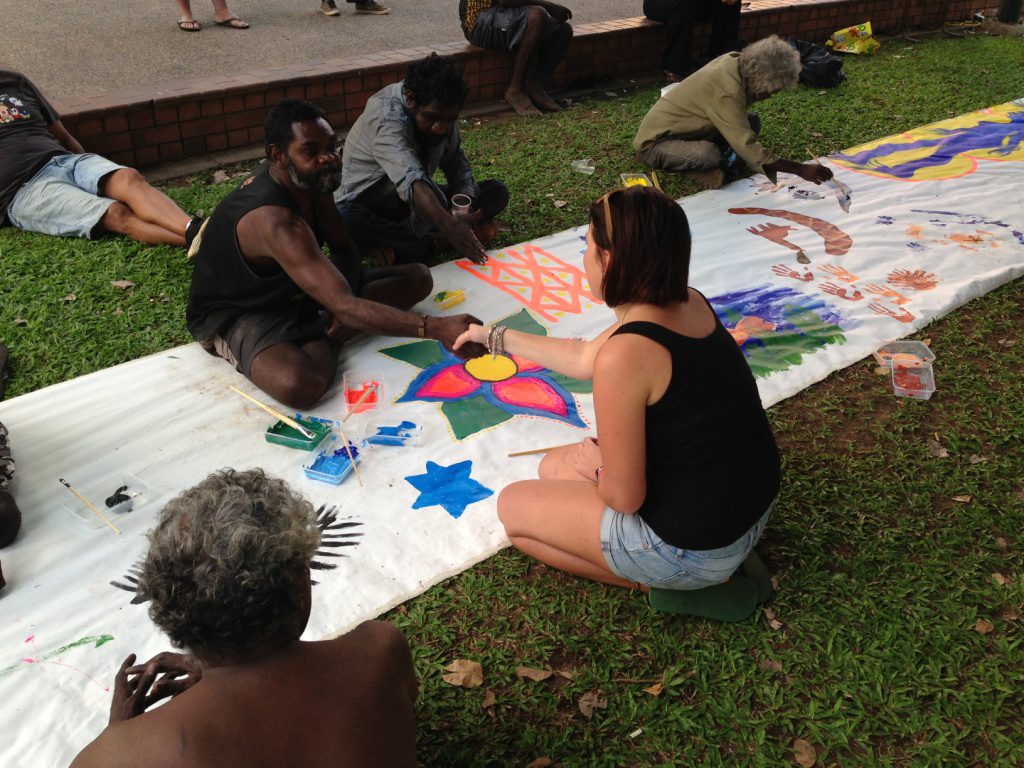 People painting on lawn