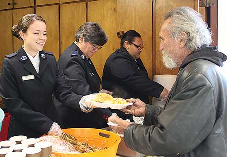 Cadets Maryellen Walters, Edith Dye-Mabie and Carolina Lopez serve home-cooked meals at Watsonville Corps’ daily homeless feeding program. Photo courtesy of CFOT