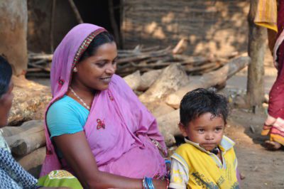 Woman and child smiling outside