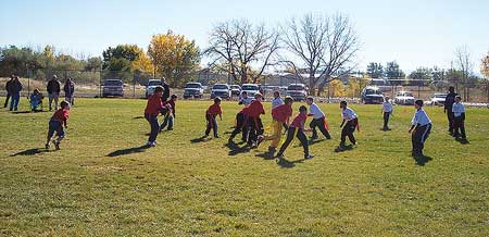 The Great Falls flag football league includes 46 teams of 10-16 children. Photo by Gary Bistodeau