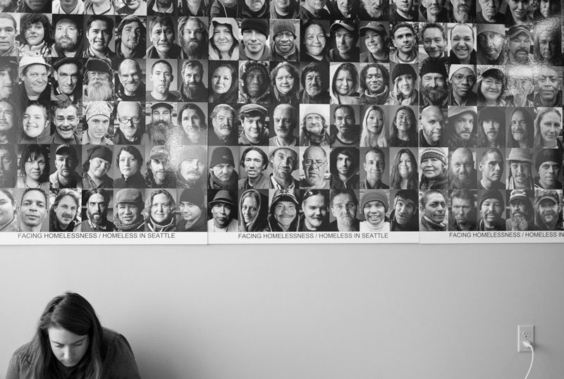 A volunteer works in front of a portrait of individuals facing homelessness | Photos courtesy of Hack To End Homelessness