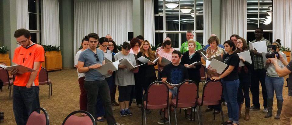 “Covenant” cast members rehearse in preparation for the musical’s debut.
