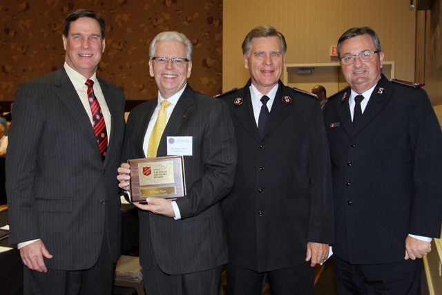 National Advisory Board Chairman Bill Burke with newly installed member Bill Flinn, the first Salvationist to serve on the board, National Commander David Jeffrey and Western Territorial Commander James Knaggs.