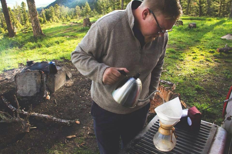 GoodWorks Coffee & Tea Founder Sam Cornthwaite making a cup of coffee overlooking the Bridger Mountain range in his home state, Montana.