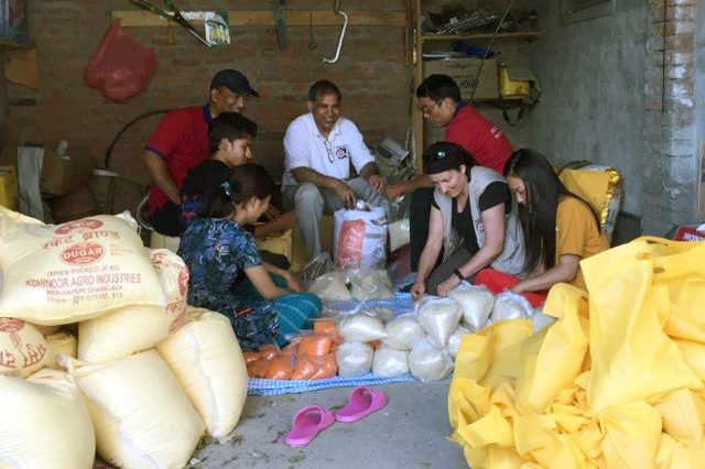 International Emergency Services Field Officer Damaris Frick assists in preparing food for distribution.