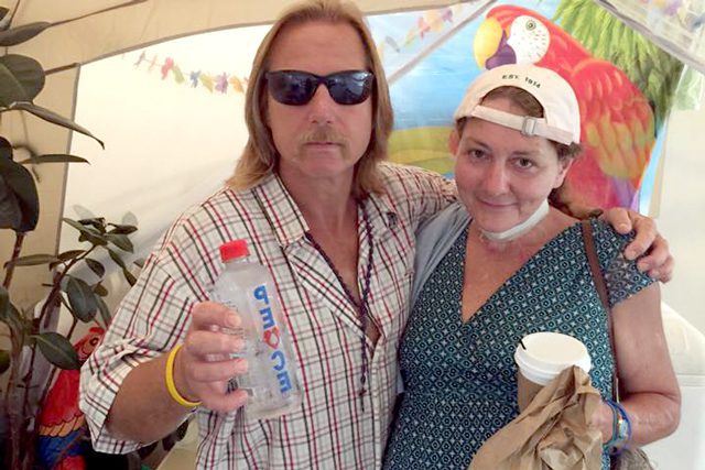 A couple came in from the heat for sack lunch and ice cold water.