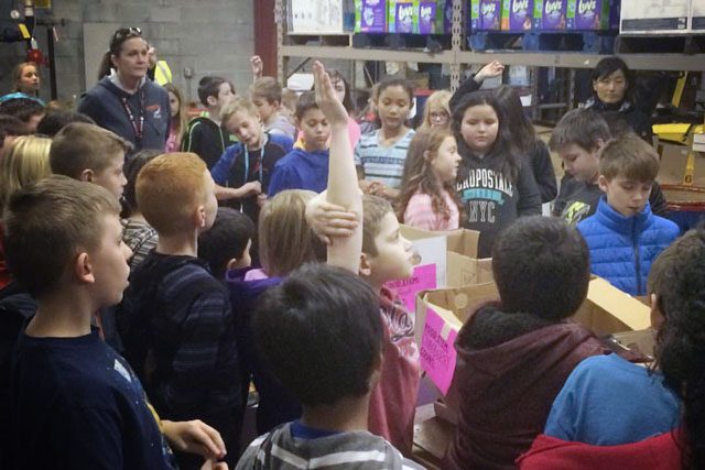 Students discuss hunger and its solution after delivering food donations to the Salem Kroc Center’s food pantry.