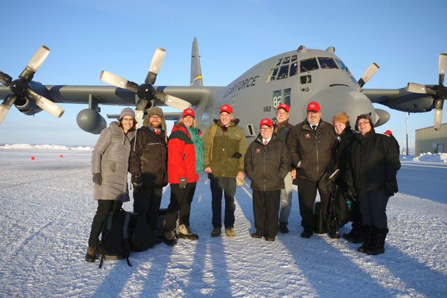 U.S. Senator Dan Sullivan of Alaska (center) poses with the Salvation Army crew in St. Mary's.