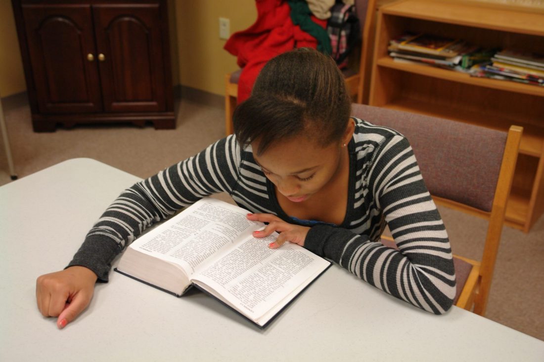 Child reading Bible