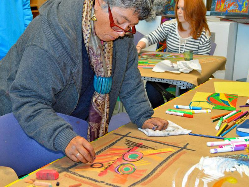 Older Woman doing art