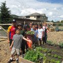 Family standing by garden