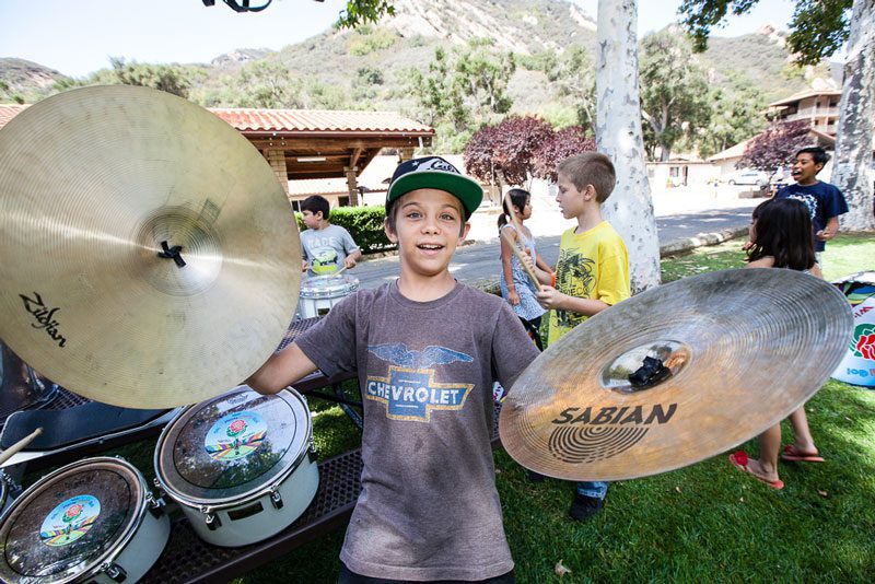 Child with tambourines