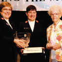 Rose Mary Hulse on stage with Officers