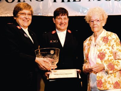Rose Mary Hulse on stage with Officers