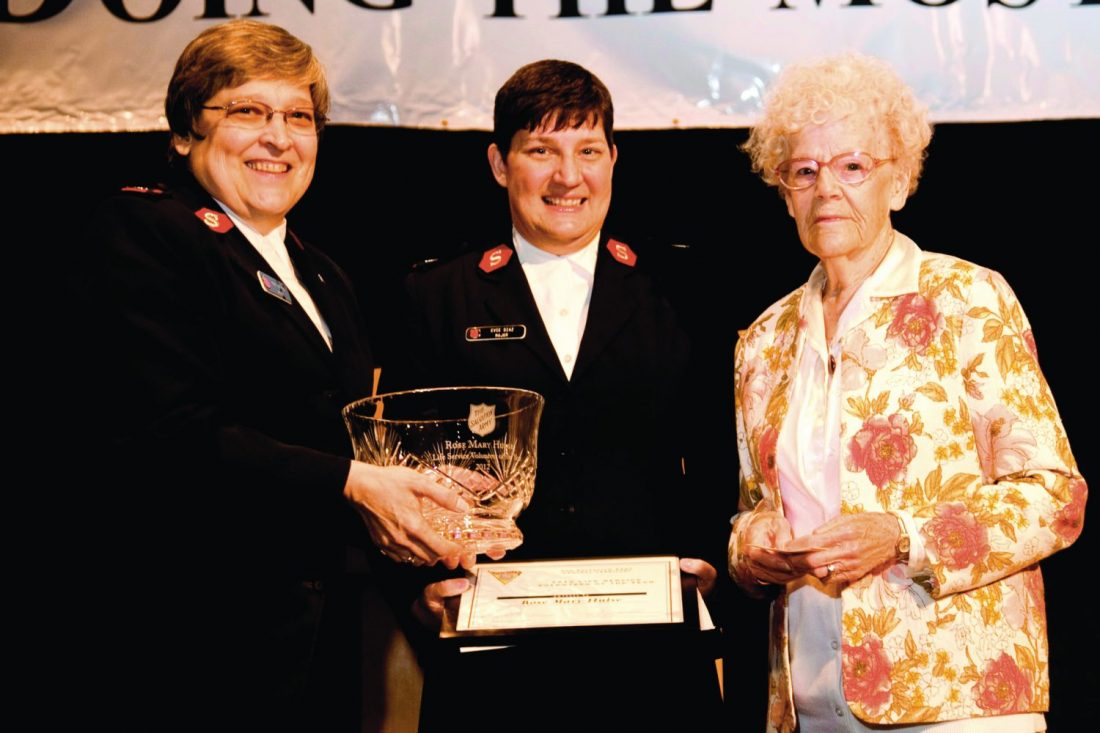 Rose Mary Hulse on stage with Officers