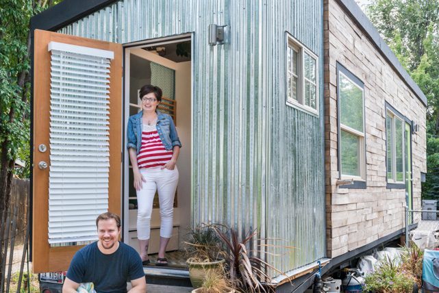 Macy Miller and husband in front of house