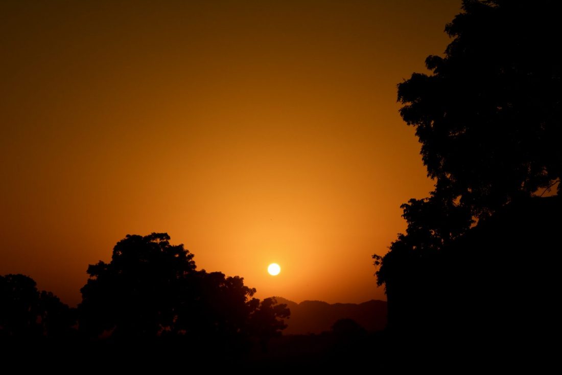 sunset behind mountains