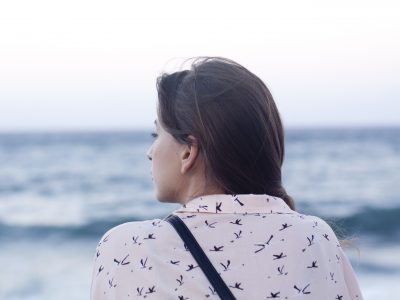 Woman looking out at ocean