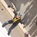 Man scaling wall