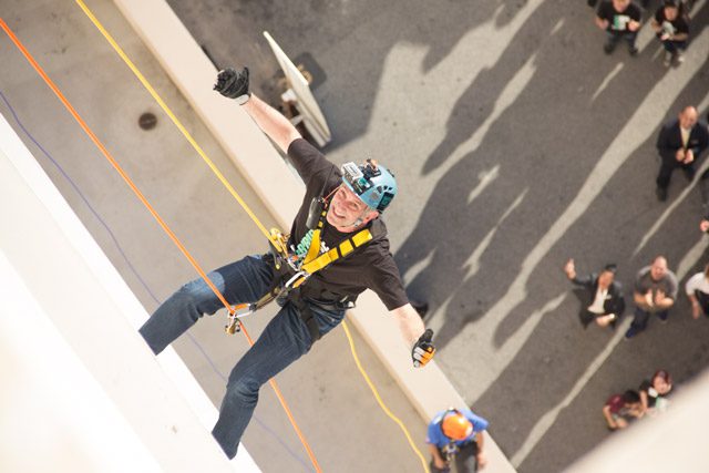 Man scaling wall