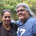 2 adults smiling at camera