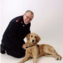 Officer smiling with dog