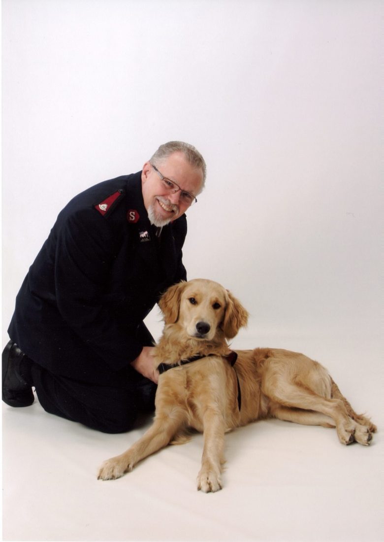 Officer smiling with dog