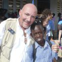 Man smiling with child