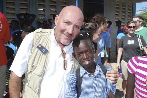 Man smiling with child