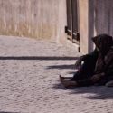 person without shoes sitting outside