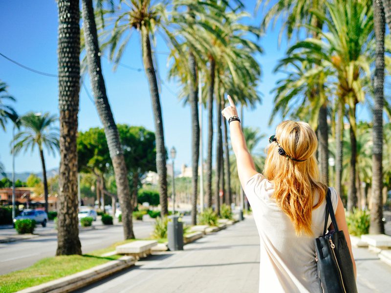 woman outside pointing