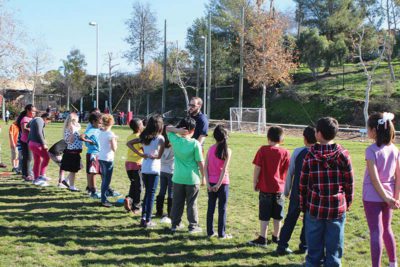 children lining up outside