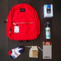 backpack with different products outside