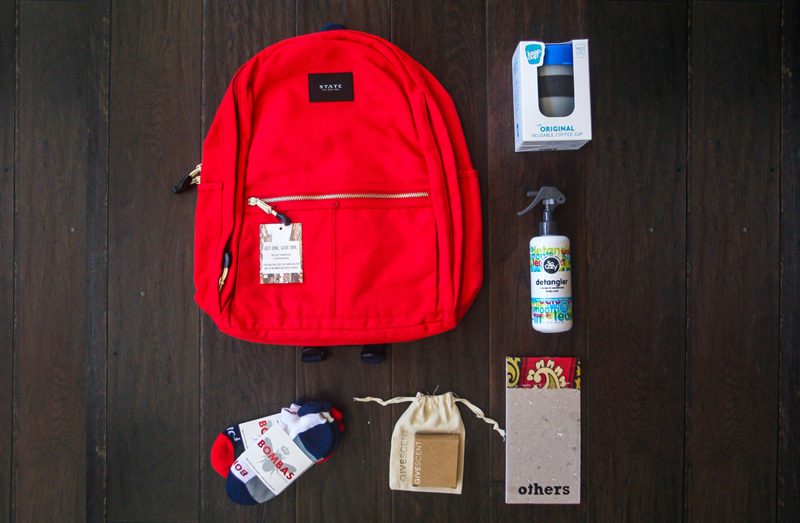 backpack with different products outside