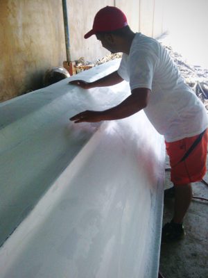 Lt. Edicson Sanchez, “Pesca Milagrosa” (Miraculous Fishing) program director, works on a fishing boat for the ministry.