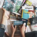 Multiple books on bed