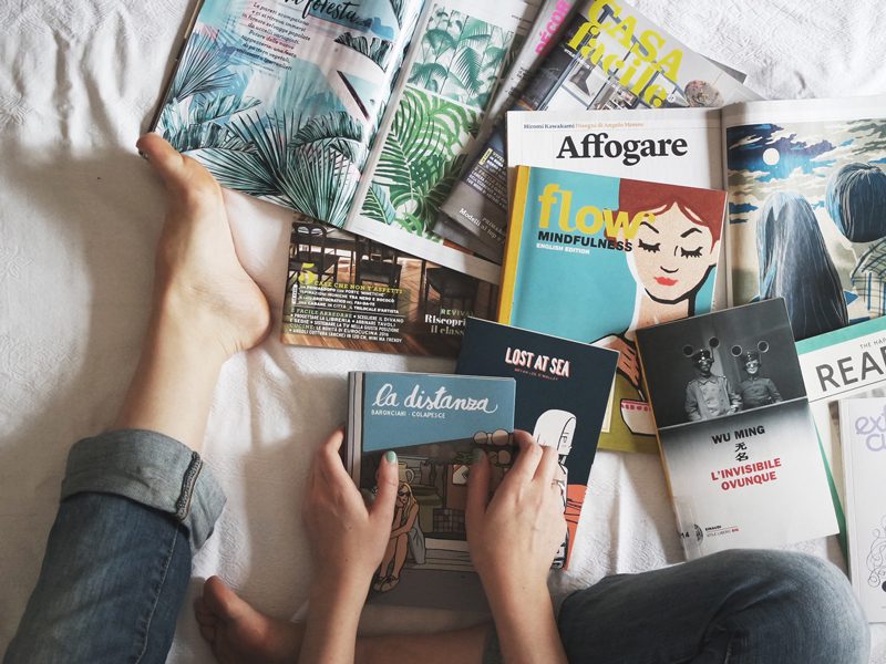 Multiple books on bed