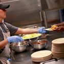 EDS volunteer serving meals