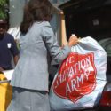Woman holding Salvation Army plastic bag
