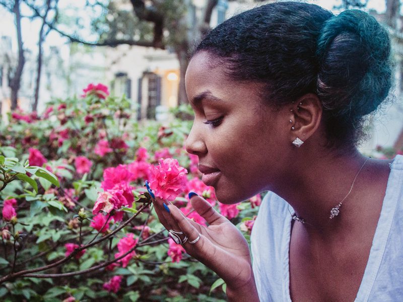Woman smelling flowers