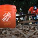 Home Depot bucket in front of volunteer working