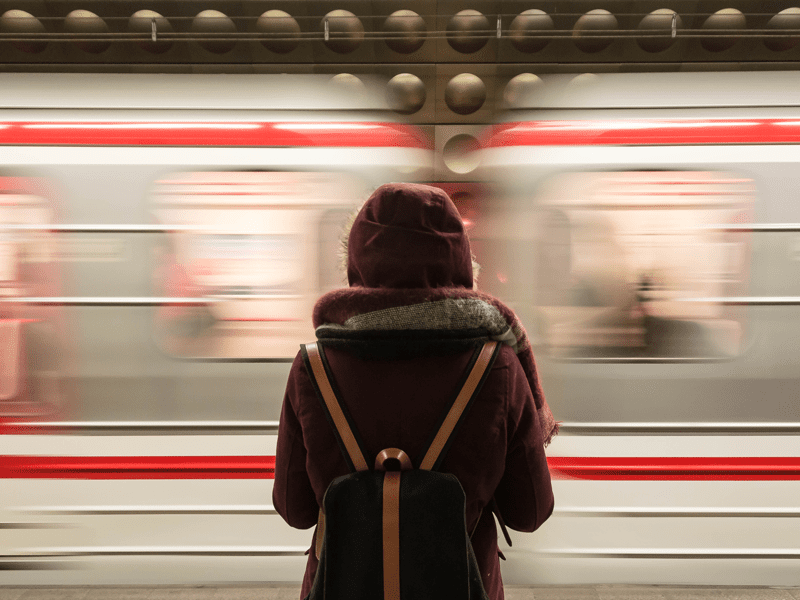 Woman watching subway pass by