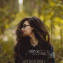 Woman looking over shoulder outside
