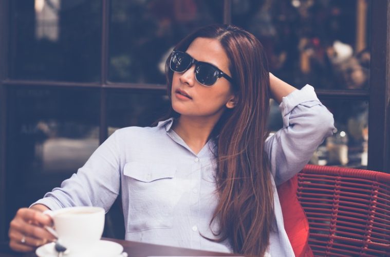 Woman sitting outside with coffee